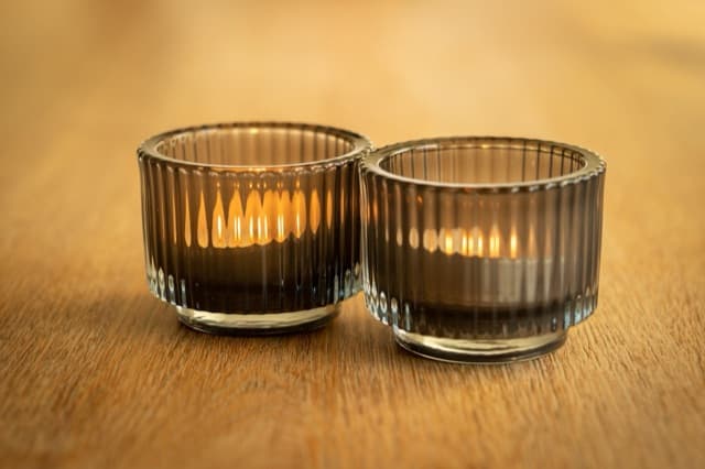 Two candles in glass holders